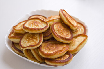 Fresh fluffy homemade pancakes on the plate. Ready to eat bakery for breakfast.