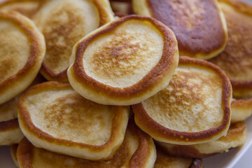 Close up fresh fluffy homemade pancakes on the plate. Ready to eat bakery for breakfast.