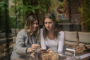 Looking at the phone while eating