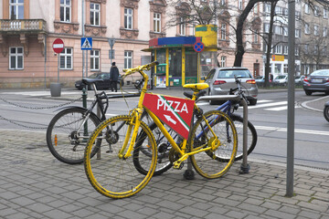 Bicycle advertising, urban buildings, street intersection ... 