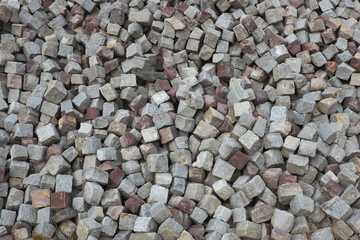 Gray cobblestone paving for road construction, background ...