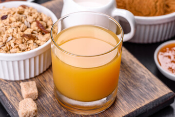 Delicious nutritious healthy breakfast with granola, eggs, oat cookies, milk and jam