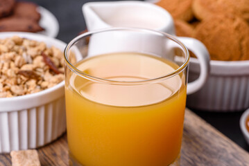 Delicious nutritious healthy breakfast with granola, eggs, oat cookies, milk and jam