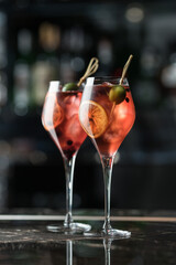 Alcoholic drink made from citrus fruits. Photo of drinks on a dark background