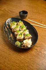 A set of hot sushi rolls with salmon