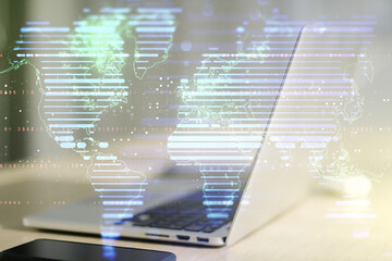 Obraz premium Multi exposure of abstract creative digital world map on laptop background, research and analytics concept