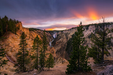 Dramatic sunset light over Yellowstone Falls from Artists Point in Yellowstone national Park