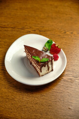 Plate with slice of tasty homemade chocolate cake