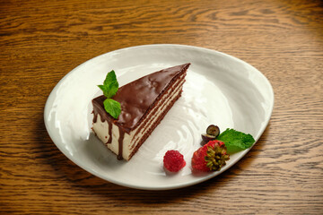 Plate with slice of tasty homemade chocolate cake