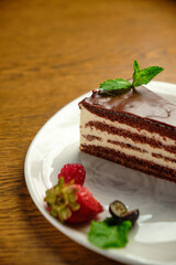 Plate with slice of tasty homemade chocolate cake