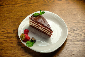 Plate with slice of tasty homemade chocolate cake