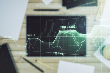 Multi exposure of creative statistics data hologram and digital tablet on background, top view, stats and analytics concept