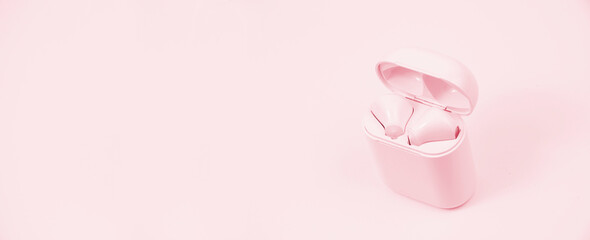 wireless headphones on a pink background. the concept of listening to music. musical relaxation illustration. modern communication devices