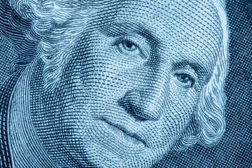 Close up of first USA president George Washington on one Dollar bancnote as symbol of economy, finances and business of America.