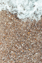 Seaside. View from above. Background from sea stones. Beautiful summer background