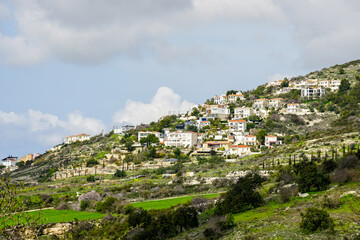 Fototapeta na wymiar Beautiful landscape in Cyprus with many private houses on the hillside