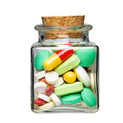 square glass jar with medicines inside. glass object on isolated background