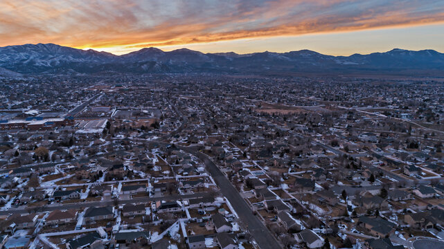 Herriman, Utah and Oquirrh Mountains at sunset with residential areas