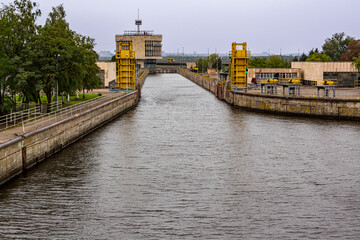 Fototapeta premium Gates open to permit ship to enter lock on Dnieper River near Zaporozhye.
