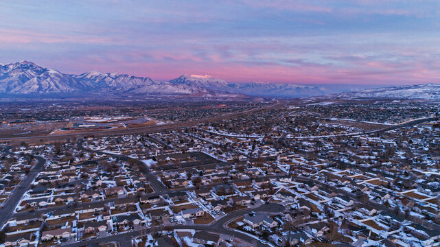 Salt Lake City Valley and Mount Timpanogos at sunset with sprawling residential areas