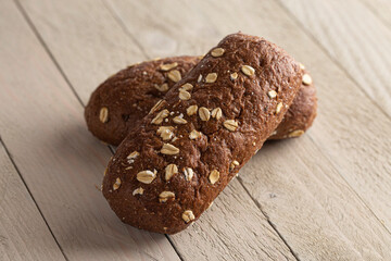 Brown Bread with Oats on a Light Wood Table