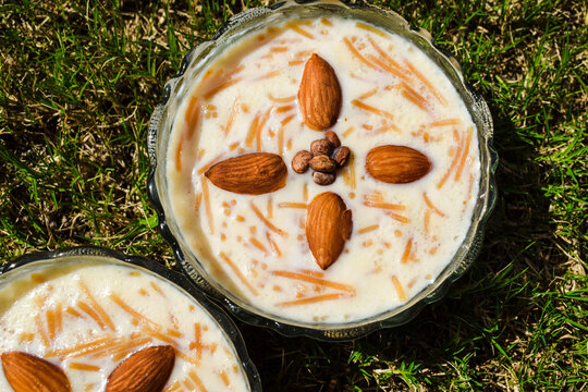 Delicious Dessert from India and Pakistan served during festivals like Diwali and Eid. Eid ul fitr special dish item Kheer seviyan. Sevaiyan in bowl on grass background