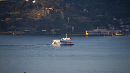 small boat walking on river Tejo in a sunny day