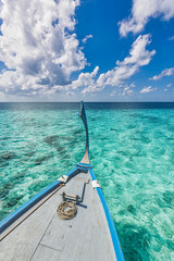 Obraz premium Amazing Maldives beach design. Maldives traditional boat Dhoni front. Perfect blue sea with ocean lagoon. Luxury tropical paradise concept. Beautiful vacation travel landscape. Tranquil ocean lagoon