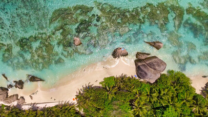 Overhead aerial view of Anse Source Argent Beach in La Digue, Seychelle Islands - Africa