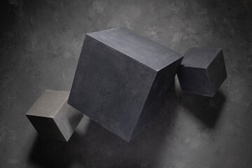 Concrete cube on abstract cement floor background texture. Geometric model concept