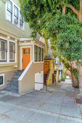 Fototapeta na wymiar Houses on a slope downhill path at San Francisco, California
