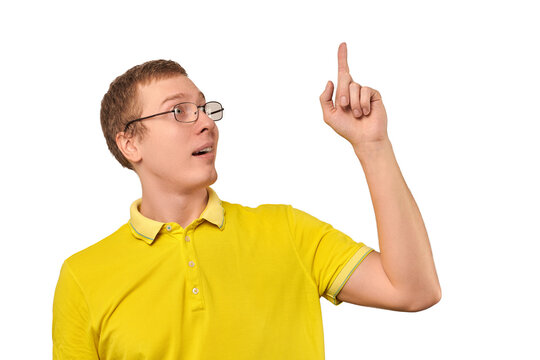 Funny young guy in corrective glasses and yellow T-shirt with eureka gesture, man got idea isolated