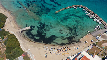 Aerial drone photo of iconic picturesque village, main port and beautiful turquoise beaches of...