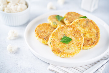 Cauliflower burgers with carrot and parsley
