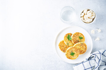 Cauliflower burgers with carrot and parsley