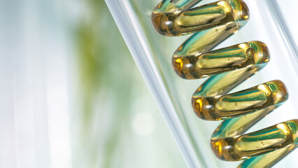 Getting natural oil from natural substances and flowers. Yellow oil flows in a spiral.