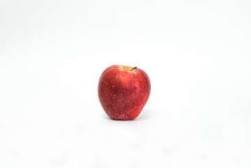 Juicy ripe red apple isolated on white background. Healthy food.