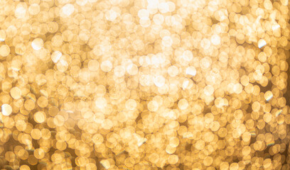 golden bokeh defocused glitter, abstract background with yellow hot bokeh