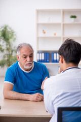 Old male patient visiting young male doctor