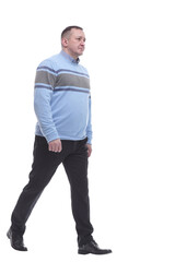 Fototapeta premium in full growth. casual man in a knitted sweater walking forward