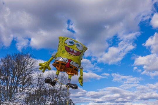 Close up view of festive foldable sponge bob against blue sky and white clouds. Sweden.