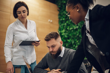 Multicultural team working together in office and having a meeting