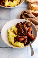 Mushroom stew with cheese in a white pan.style rustic