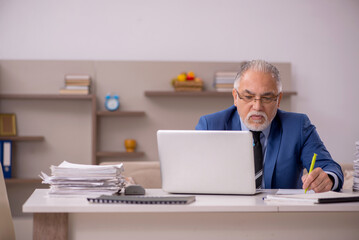 Old male boss working from home during pandemic