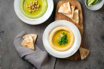 Meze with hummus and fresh vegetables, top view
