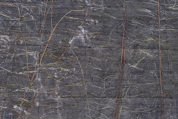 Concrete block with twigs background texture