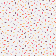 Seamless repeat pattern of colorful sugar sprinkles vector illustration