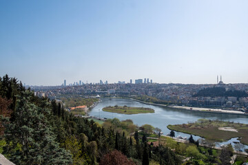 Fototapeta premium Panoramic view from the Pierre Loti Viewpoint in Istanbul. Golden Horn and Bosphorus. April 2022