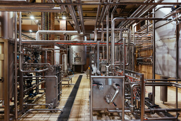 Industrial steel vats connected by the pipeline