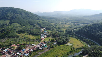 Fototapeta premium Top view of the village, fields and forests near the village